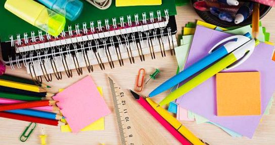 School and office accessories on wooden background