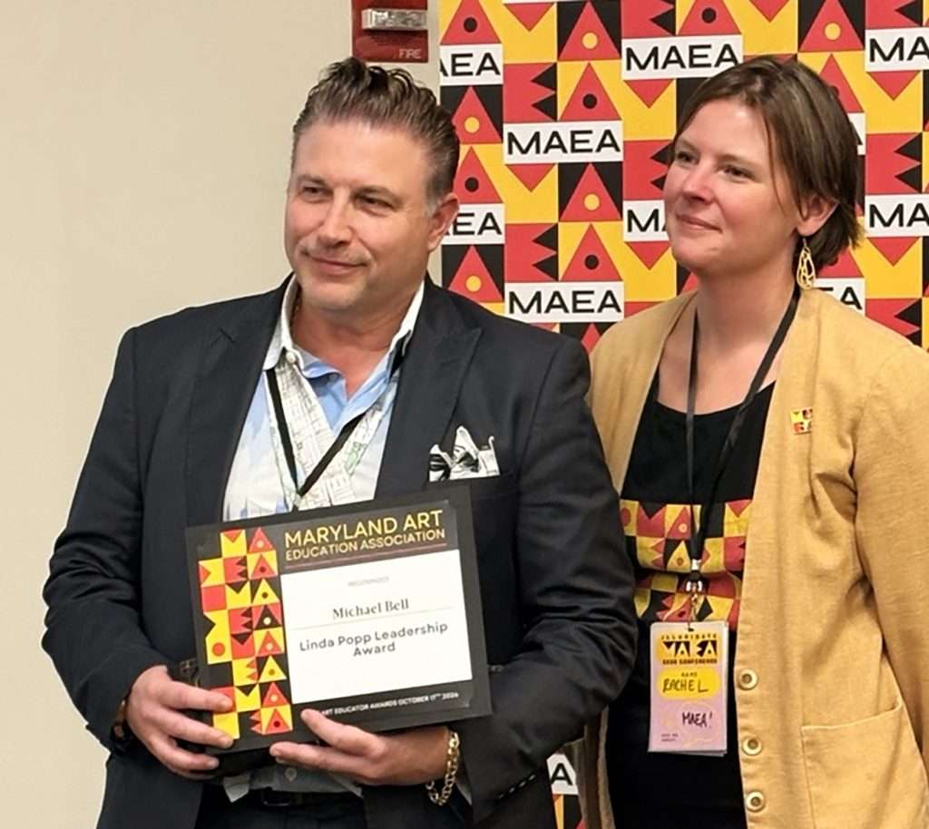 Michael Bell receiving Linda Popp State Leadership Award presented by MAEA President